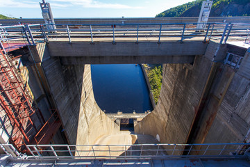 Industrial photography. Closed locks of Zeya hydroelectric power station against the background of...
