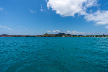 beautiful soft wave clear blue transparency sea ocean water and rocks at the bottom of the tropical paradise beach coast summer sea view at Samed Island, Rayong, Koh Samet, Thailand.