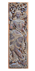 An ancient mural wood thai angel carving on wood wall thailand.