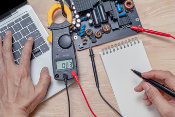 motherboard repair close-up, electronic hardware concept.