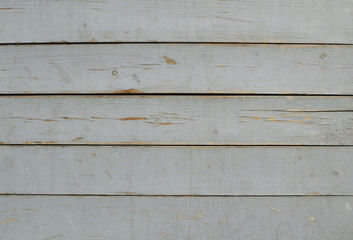 Old boards with old white faded paint.