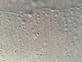 Circle and hole pattern in sand  beach texture, Crab nest, Abstract background concept