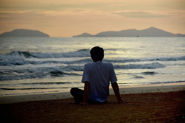 Man on the beach in sadness feeling 