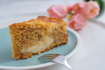 home made carrot cake cheesecake on a table