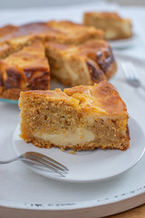 home made carrot cake cheesecake on a table