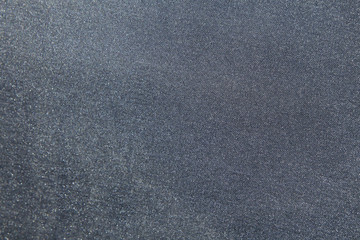 Gray shiny fabric material in zoom.