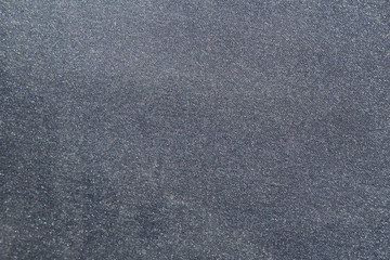 Gray shiny fabric material in zoom.