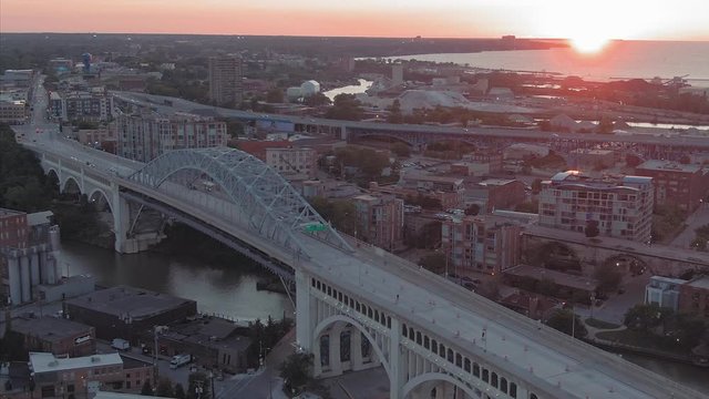 Aerial: Cuyahoga river& Detroit-Superior Bridge at sunset. Cleveland, Ohio, USA