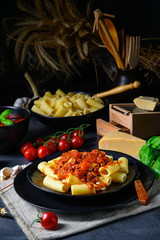 Rigatoni pasta with Bolognese sauce and fresh basil