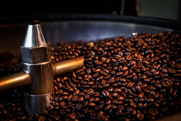 coffee beans process roasted spin machine close up and selective focus