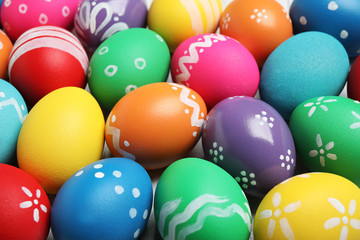 Fototapeta na wymiar Many bright Easter eggs as background, closeup view