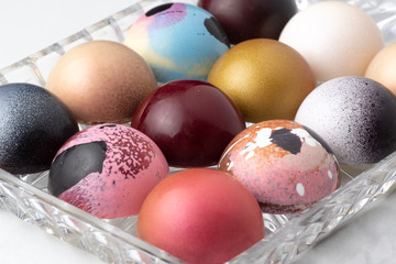 Colorful modern chocolate bonbon truffles on marble