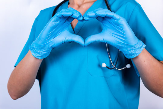 Doctor Hands In Gloves Making Heart Shape