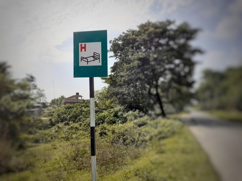 Rectangular Green Color Hospital Sign Near The Street