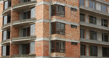 Newly built building in a residential complex. New construction site