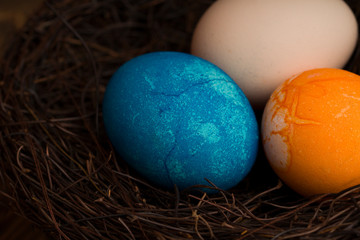 Easter eggs on rustic wooden background.  Easter Eggs And Nest