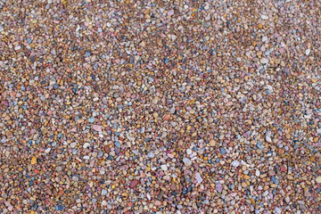 Bright and small river stones. Beautiful horizontal background