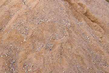 River sand with stones. The use of river sand in construction