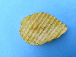 a yellow potato chips eatable food isolated on sky blue background
