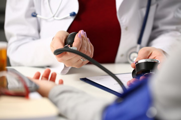 Female doctor arms make medic procedure closeup. Physical cure arterial beat exam tool nurse...