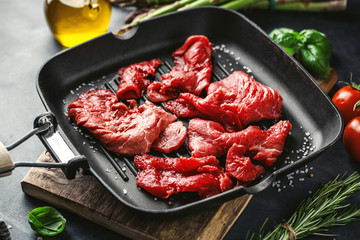 Thin beef slices with ingredients for cooking