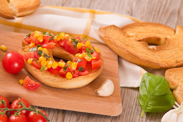 Friselle with tomatoes and mais.	