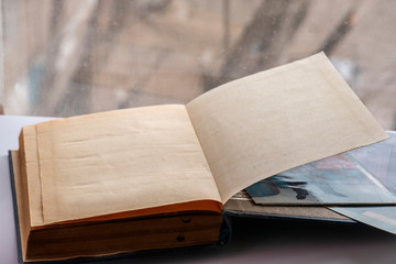 Old book with photos close-up, a book on a light background.