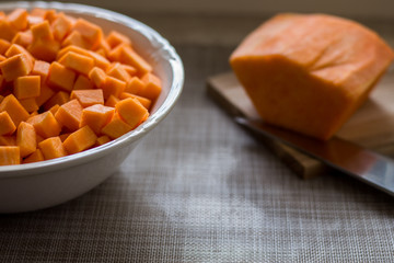yellow pumpkin cut into cubes and put in a bowl