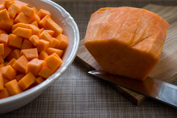yellow pumpkin cut into cubes and put in a bowl