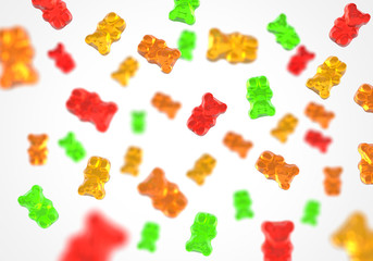 Jelly gummy bears flying candy background. Fruit gum candies theme. Red, orange, yellow and green.