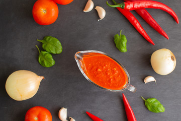 Red hot chili sauce in a gravy boat