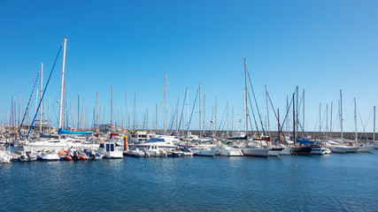 Fototapeta na wymiar Tranquil sports marina with 344 berths for large yachts and vessels, popular among year-round sailing aficionados, Marina San Miguel, Tenerife, Canary Islands, Spain