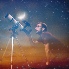 Amateur astronomer looking at the stars with a telescope. Astronomy and astrology concept.