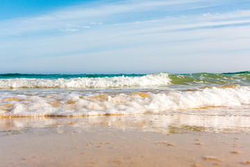 Bursts of sea waves on a tropical sea beach,