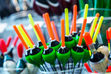 different fishing floats on the window of a fishing store. Shallow depth of field © OlegDoroshin