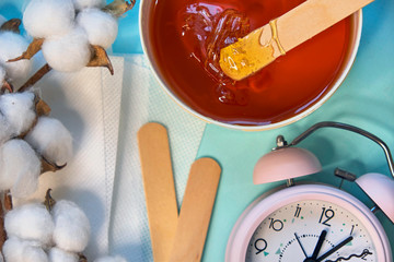 set of means of hair removal on a blue background. Wax strips. Minimalism, choice. top view, flatlay photo