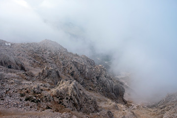 Beautiful view to Western Taurus mountain range with cloudy sky, captured from Tahtali mountain's peak.