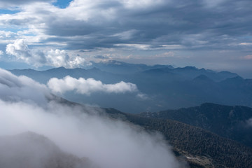 Beautiful view to Western Taurus mountain range with cloudy sky, captured from Tahtali mountain's peak.