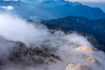 Beautiful view to Western Taurus mountain range with cloudy sky, captured from Tahtali mountain's peak.