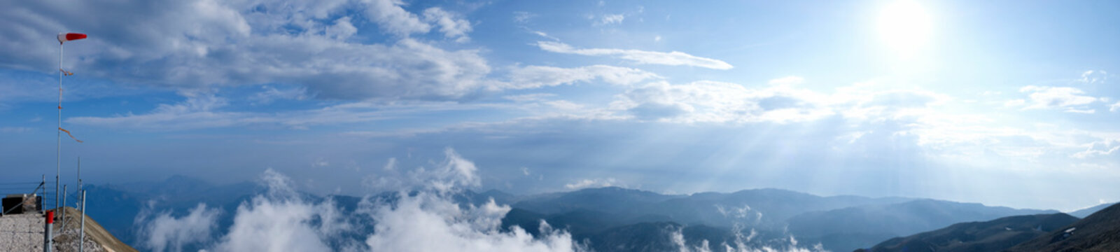 Panoramic view to Western Taurus mountain range with cloudy sky, captured from Tahtali mountain's peak.