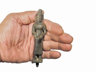 Obraz premium view of ancient Uma goddess bronze standing Khmer Statue Bakheng Style (893th - 925th Century) in hand isolated on white background.