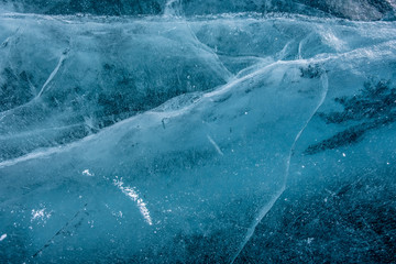 Cracks in the ice. Frozen lake surface. Cracked ice.