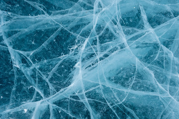 Cracks in the ice. Frozen lake surface.