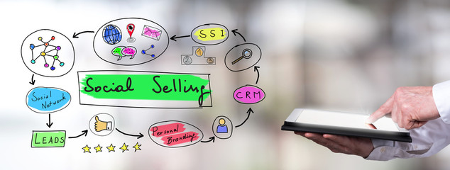 Social selling concept with man using a tablet