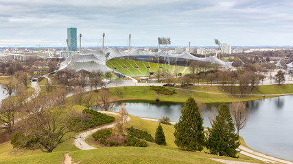 Munich, Bavaria / Germany - Feb 20, 2020: Olympic Park with lake & Olympic Stadion. One of the main...