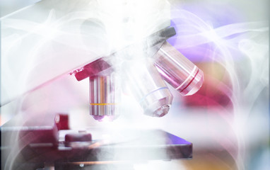 Microscope with metal lens at laboratory.