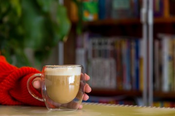 Transparent double wall glass mug with espresso coffee  at home at work