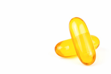 Close up of Fish oil capsules with omega 3 on white background. Copy space for your text, Health care concept.