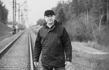 Obraz premium Crisis of middle age. Mature European man with a sad philosophical mood. The concept of life after 50 years, problems and depression. 