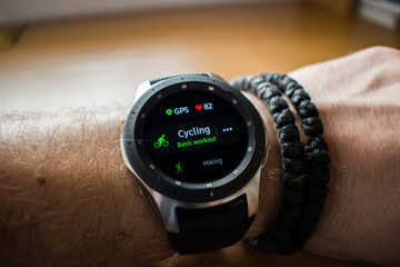 Smart watch on mans hand, cycling workout, exercise